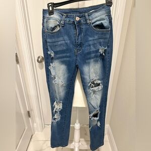 Kunmi ripped light blue skinny jeans.